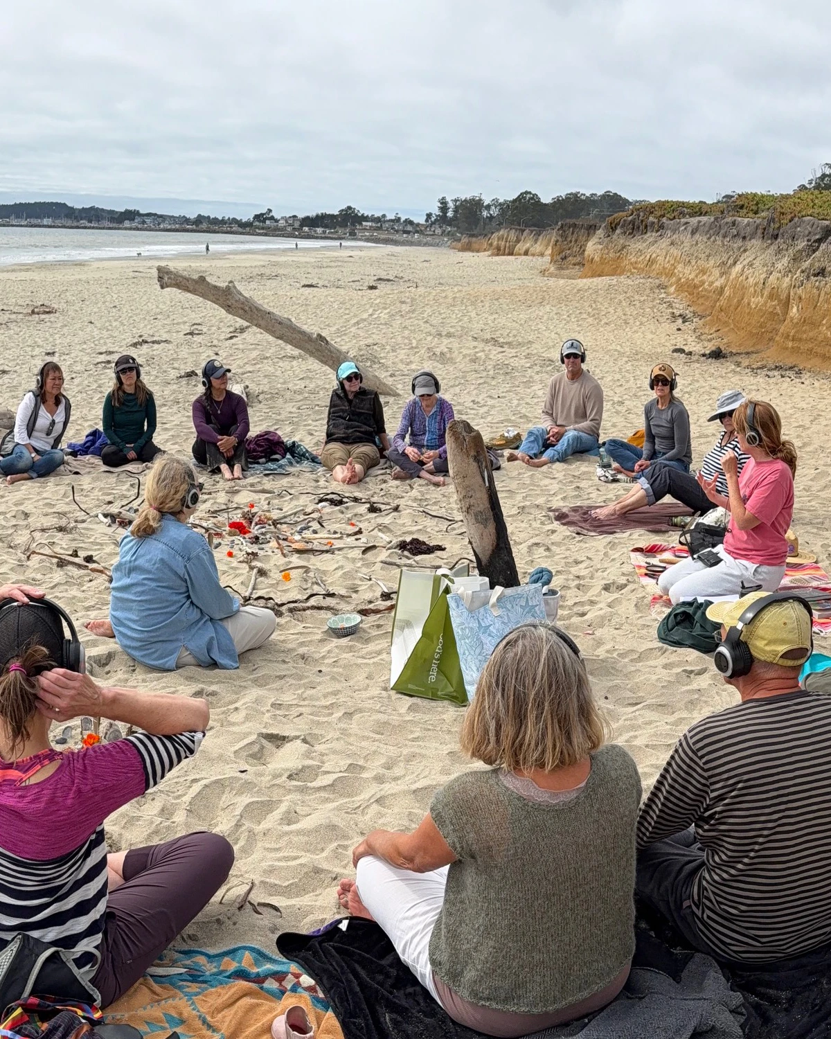 A small group of people sharing a group experience with sound and shared presence